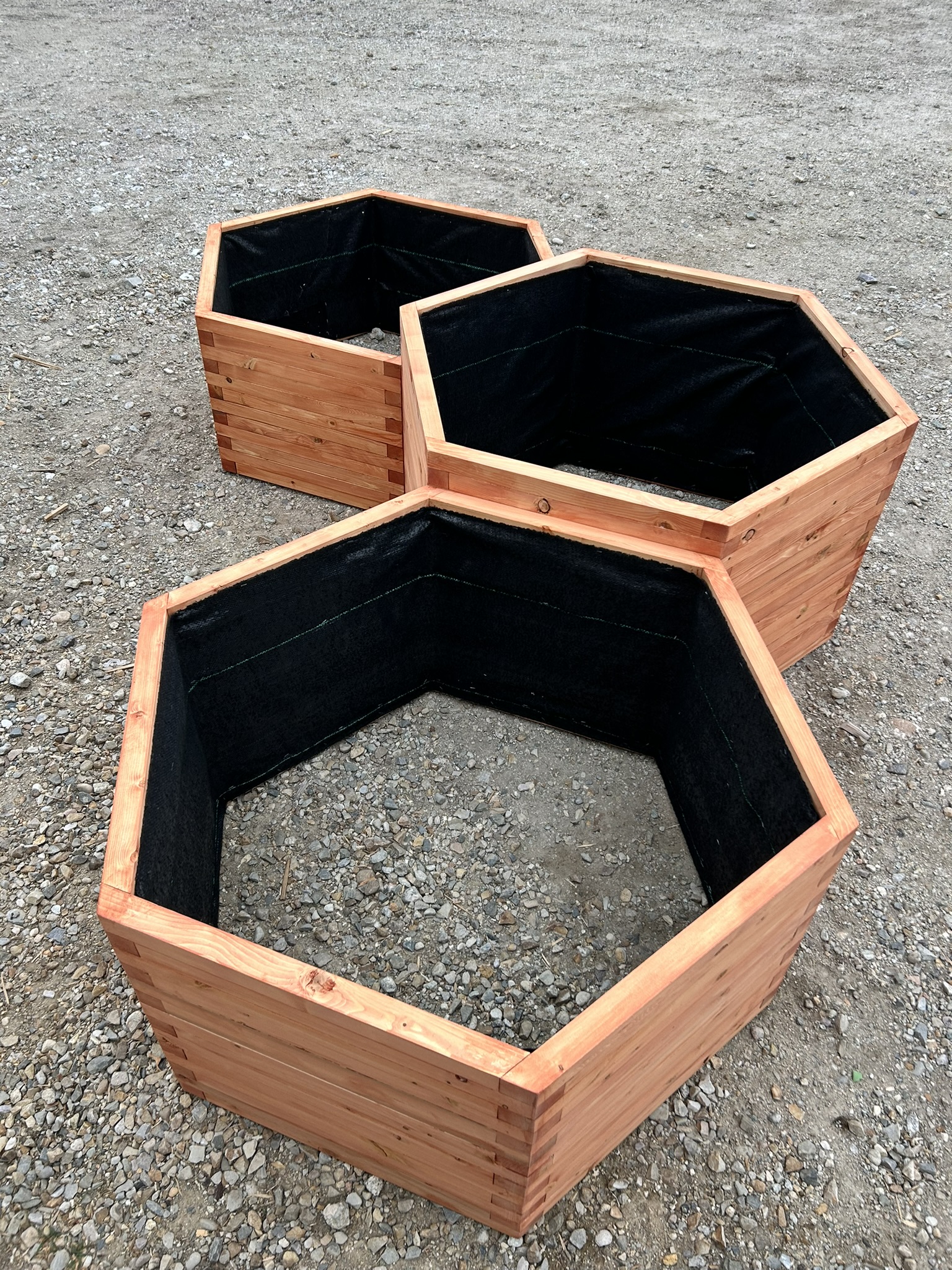 Rustic wood planter box with cross-brace detail